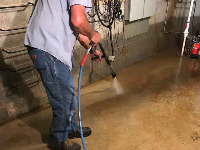 pressure washing floor during remodel work at cox