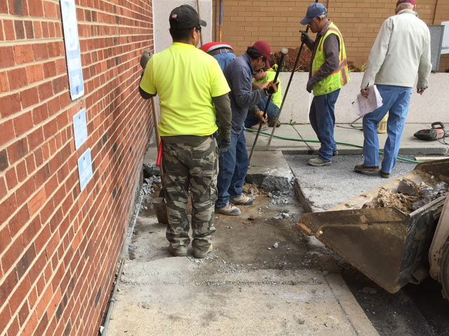 wells fargo exterior work removing concrete during renovation