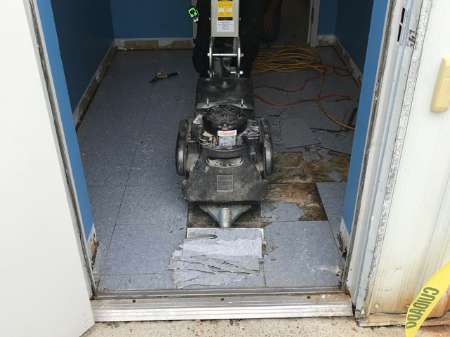 removing old tile during wells fargo interior remodel work